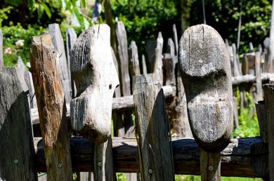 Wooden shoes on a fence